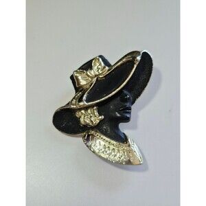 Torino gold tone and black matte brooch